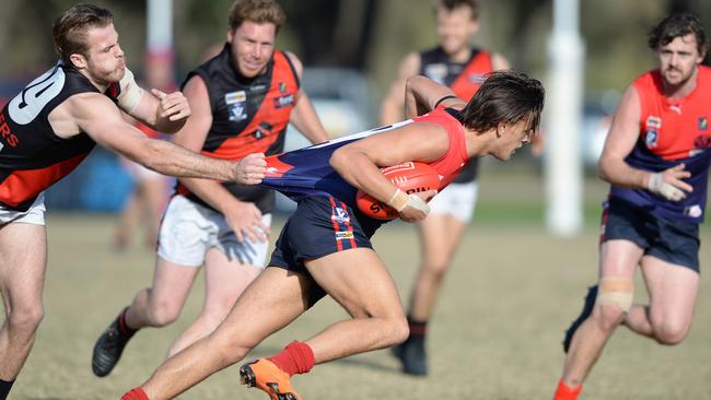 Frankston Bomber Josh Chapman (left) grabs Mt Eliza’s Tom Freeman by the jumper during Saturday’s game. Picture: Chris Eastman