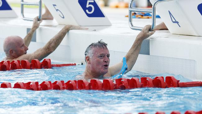 Cairns MP Michael Healy completes his swim leg in the inaugural CLAMS charity swim relay at Tobruk Memorial Pool, raising money for the Far North Queensland Hospital Foundation earlier this year. Picture: Brendan Radke