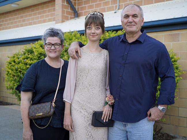 Chrisse and Enrico Favini with daughter Rosanna Favini at the Mackay North State High School formal at Windmill Function Centre, November 19, 2021. Picture: Heidi Petith