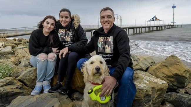 Rebecca, Kelly and Mark Green with their dog Maisie at Brighton Beach. Picture: Roy VanDerVegt