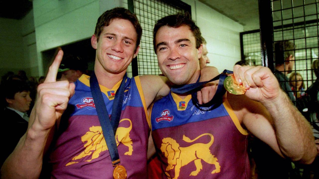 Aaron Shattock and Chris Scott with their Premiership medals in 2002