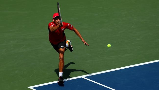 Alex de Minaur returns a shot during his Men's Singles fourth round match against Grigor Dimitrov of Bulgaria.