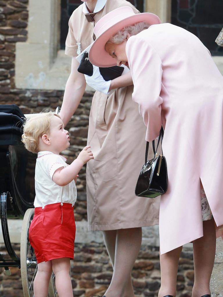 Prince George of Cambridge with his grandmother, Queen Elizabeth II and Prince George’s nanny, Maria Teresa Turrion Borrallo leave the Church of St Mary Magdalene on the Sandringham Estate for the Christening of Princess Charlotte of Cambridge on July 5, 2015 in King’s Lynn, England. Picture: Getty Images