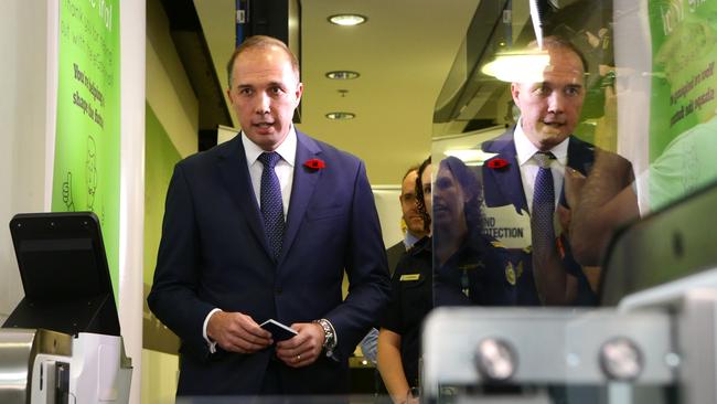 Minister for Immigration and Border Protection Peter Dutton using a SmartGate at Brisbane Airport. Pic Darren England.