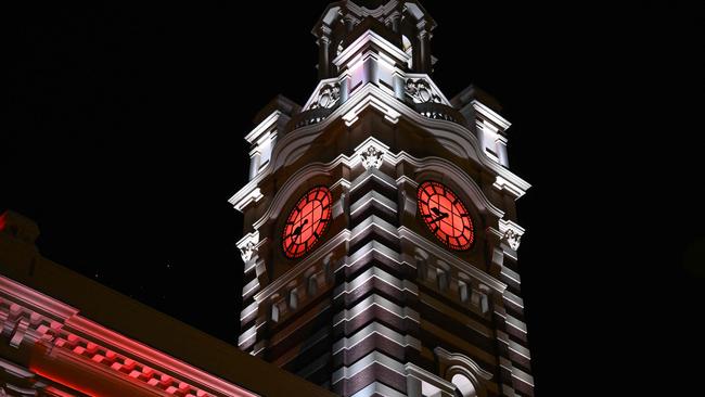 Melbourne's Flinders Street Station lit up in the colours of the Japanese flag on Saturday night. Picture: AFP