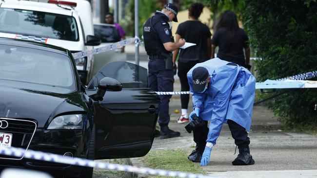 The suburb of Edge Hill went into lockdown on Thursday, March 28, after reports that a man had been shot on Collins Ave. Police forensic officers inspected a black Audi TT coupe related to the shooting, found abandoned on Pease Street. Picture: Brendan Radke