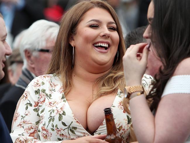 A female racegoer enjoys a drink during day one of the Randox Health Grand National Festival at Aintree Racecourse.. Picture date: Thursday April 6, 2017. See PA story RACING Aintree. Photo credit should read: David Davies/PA Wire