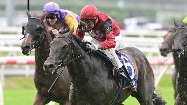 Millane surges through the mud to win at Eagle Farm. Picture: Grant Peters/Trackside Photography.