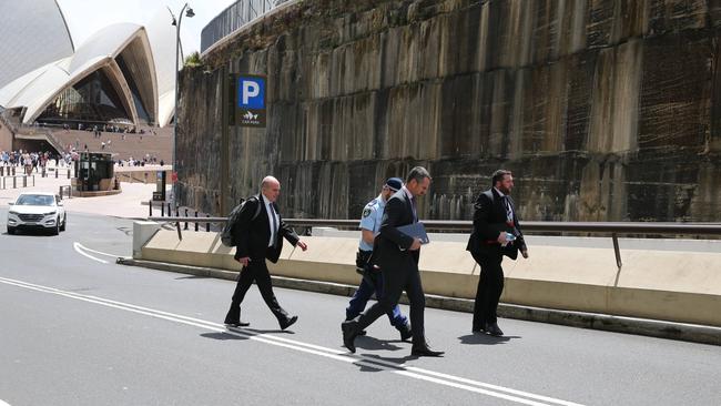 Detectives seen leaving the residence of Alan Jones on Monday. Picture: NewsWire / Gaye Gerard