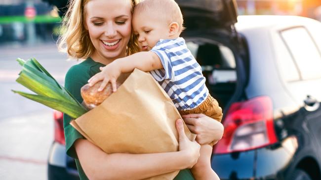 Back to the future: A mum juggles her shopping in a brown paper bag. Picture: Supplied