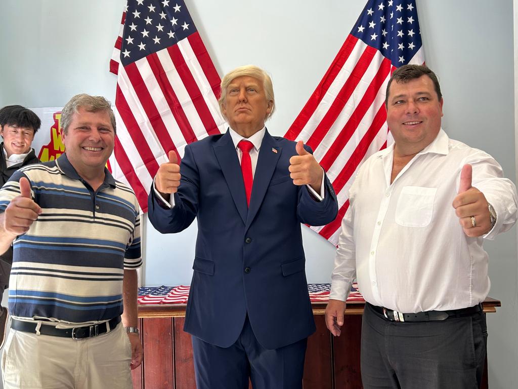 Gold Coast Wax Museum's Peter and Mark Tomlinson with the newly unveiled Donald Trump wax figure. Picture: Rosie Gale