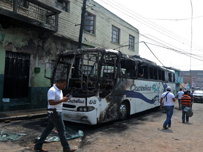 A bus driver was this month set on fire by gang members for not paying a protection fee.