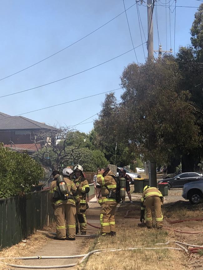 Firefighters beside the property.