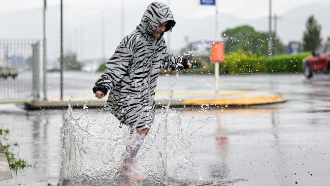 The wet season has arrived in Far North Queensland, with heavy rain falling across Cairns overnight. Pheobe Molenaar, 9, embraced the wet weather by finding some puddles to jump in. Picture: Brendan Radke