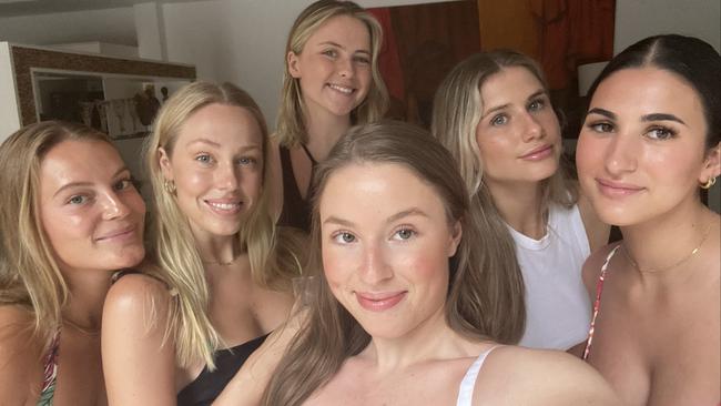 Journalist Carly Douglas (centre front) and friends in Bali before Jetstar flight was delayed following major cancellations