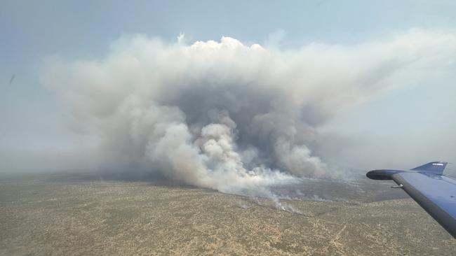 A wildfire in the Barkly region has burnt more than 9300sq km, calling for interstate water bombers to help fight the “uncontrolled” blaze. Picture: Bushfires NT