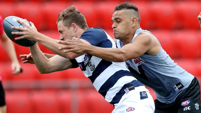 Geelong’s Mitch Duncan marks in front of Port Adelaide draftee Dom Barry. Picture: Calum Robertson