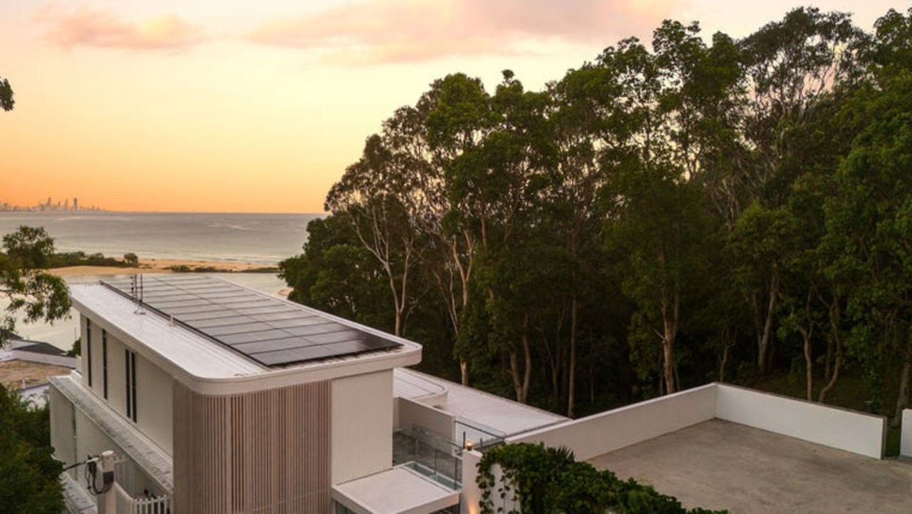 The home is sprawled over four storeys on a steep block