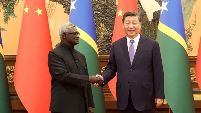 Chinese President Xi Jinping with Mr Sogavare in Beijing in 2023. Picture: Reuters