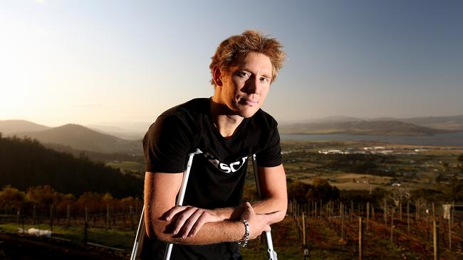 Cameron Wurf, 32, of Mount Rumney is having a year off the bike and is back in Tas for a few weeks after breaking his foot. but he is continuing to train as he prepares for the Kona long distance triathlon next month.