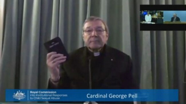 Cardinal Pell begins his testimony by swearing on Bible.