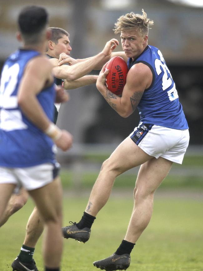 Mitch Minns spins away from the Ramblers’ Simon Jaspers. Picture:AAP/Dean Martin