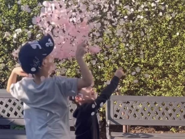 Jimmy Bartel's two sons Henley and Aston pop the balloon at the gender reveal for Bartel and his partner Amelia Shepperd. Picture: Supplied