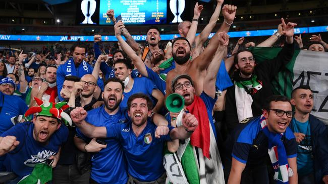 Italy fans celebrate after their side claimed the Euro 2020 title. Photo: by Laurence Griffiths/Getty Images