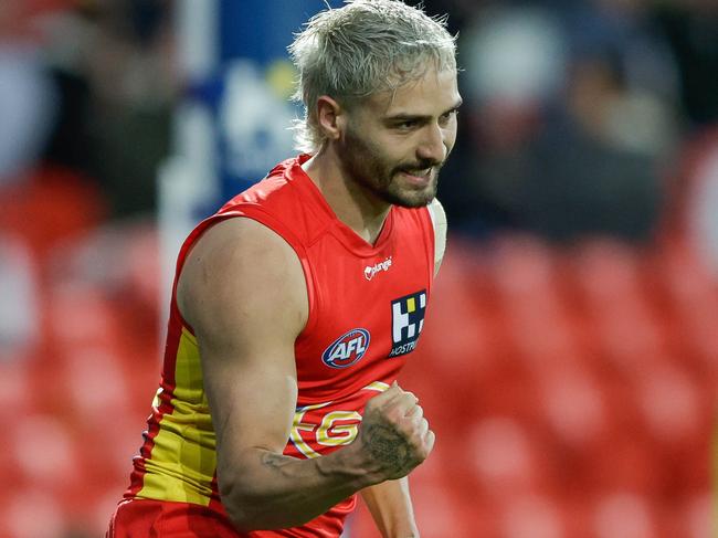 GOLD COAST, AUSTRALIA - AUGUST 13: Izak Rankine of the Suns celebrates a goal during the 2022 AFL Round 22 match between the Gold Coast Suns and the Geelong Cats at Metricon Stadium on August 13, 2022 in the Gold Coast, Australia. (Photo by Russell Freeman/AFL Photos via Getty Images)