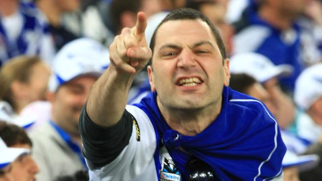 An Angry Bulldogs fan shouts at Willie Mason.