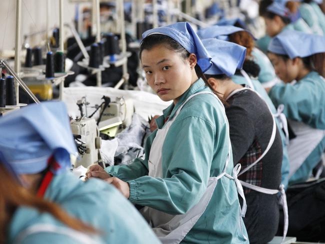 Chinese workers at work at a textile factory in Huaibei, east Chinese Anhui province.