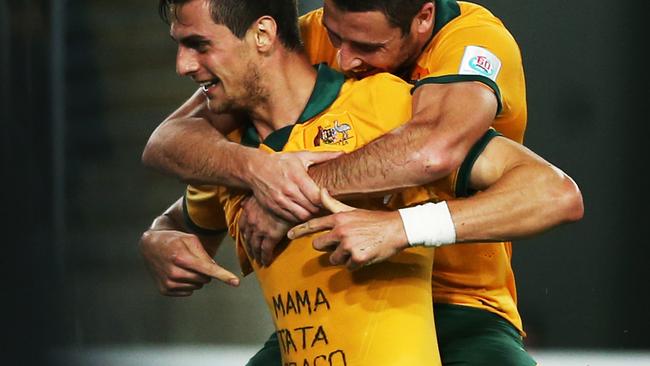 Tomi Juric thanks his family while Matthew Leckie celebrates his goal.