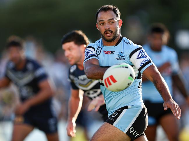 SYDNEY, AUSTRALIA - APRIL 21: Braydon Trindall of the Sharks passes the ball to a team mate during the round seven NRL match between Cronulla Sharks and North Queensland Cowboys at PointsBet Stadium, on April 21, 2024, in Sydney, Australia. (Photo by Brendon Thorne/Getty Images)