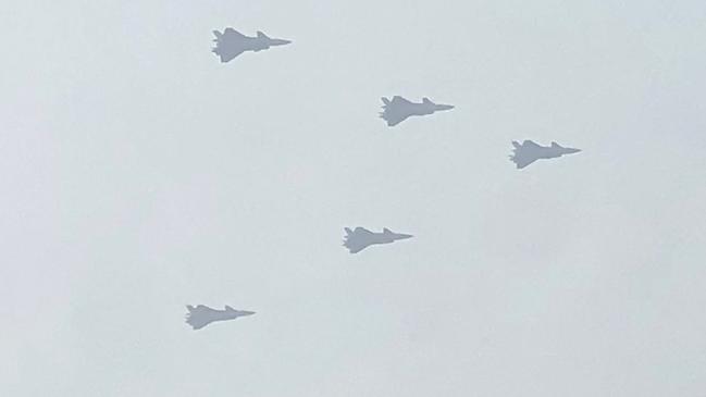 While the West sends words, China sends warplanes. Picture: AFP