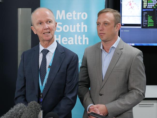 Fallen Metro South chief executive Stephen Ayre (left) with Health Minister Steven Miles last year