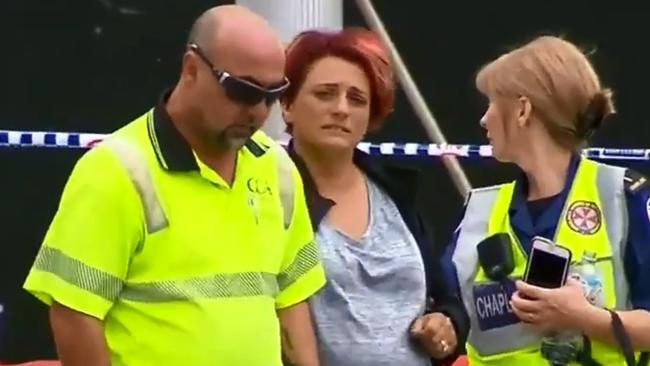 The Parents of Christopher Cassaniti at the Scaffolding collapse scene at Macquarie Park on Monday. Picture: Nine News