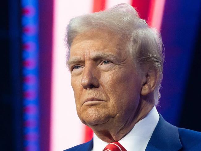 PHOENIX, ARIZONA - DECEMBER 22: U.S. President-elect Donald Trump looks on during Turning Point USA's AmericaFest at the Phoenix Convention Center on December 22, 2024 in Phoenix, Arizona. The annual four day conference geared toward energizing and connecting conservative youth hosts some of the country's leading conservative politicians and activists.   Rebecca Noble/Getty Images/AFP (Photo by Rebecca Noble / GETTY IMAGES NORTH AMERICA / Getty Images via AFP)