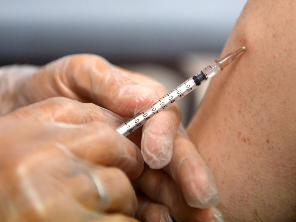 A a pharmacist administers a dose of Imvanex, a vaccine to protect against Monkeypox virus, at a pharmacy in northern France. Picture: AFP