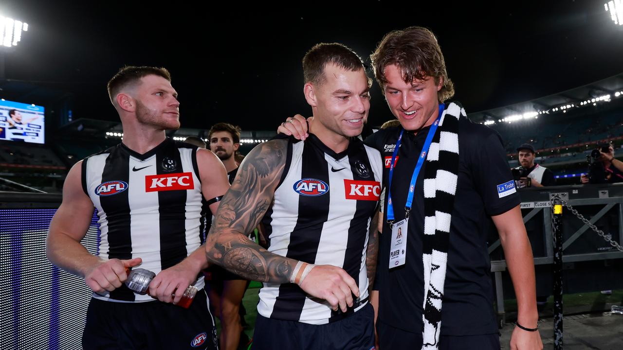 Jack Ginnivan with Taylor Adams and Jamie Elliot after Collingwood’s round 1 win.