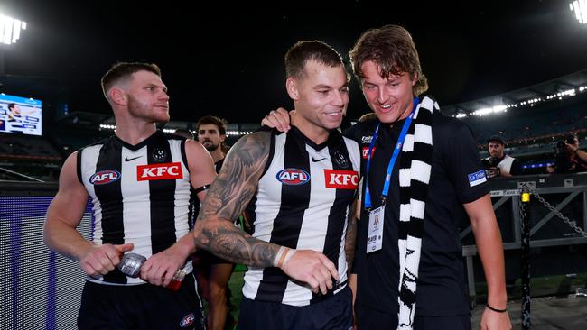 Jack Ginnivan with Taylor Adams and Jamie Elliot after Collingwood’s round 1 win.