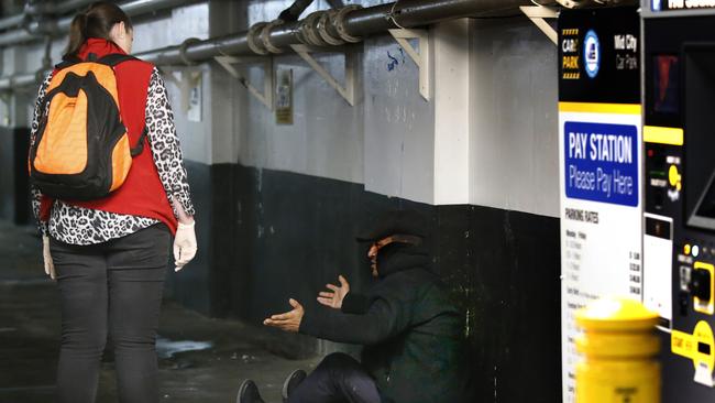 A rough sleeper is found in a city carpark. Picture: David Caird