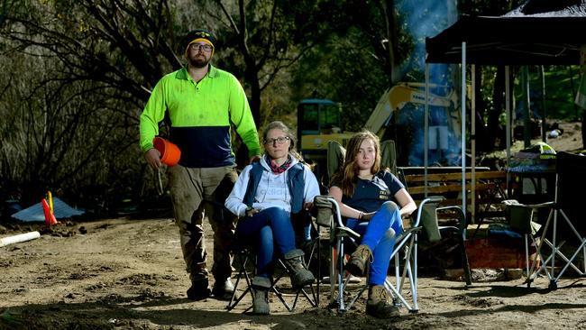 Marc, Rhiann and Estelle Webb on their property in Kenton Valley which was destoyed by the Cudlee Creek bushfire. Photo Sam Wundke.