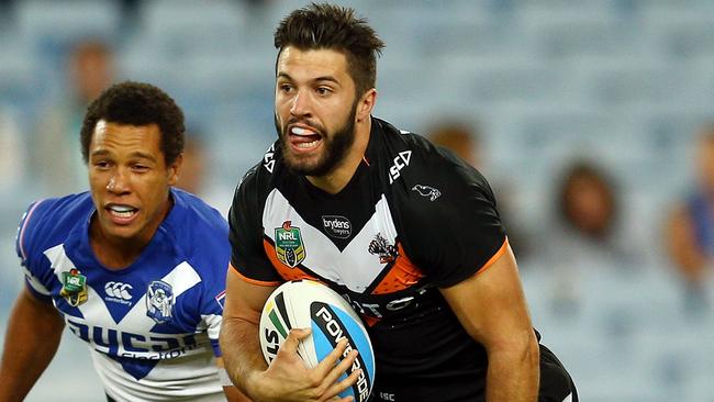 West Tigers player James Tedesco on the break.