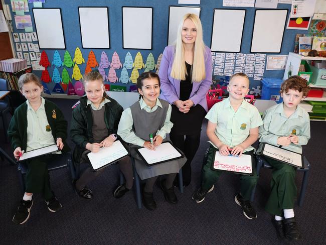 Keiraville Public School teacher Vanessa May is looking forward to teaching the new syllabuses to Year 3 students Zoe Markwick, Poppy Thomas, Zara Kotamanidis, Hunter Markwick, and Cillian Finlay. Picture: Rohan Kelly