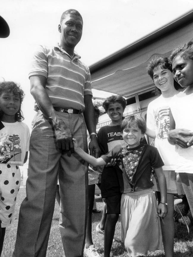 West Indies fast bowler Joel Garner meets five-year-old Coralie Young at Gardens in 1991.