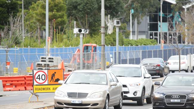 At least 56,000 Victorian motorists will still have to cough up for fines from red light and speed cameras that were infected with a virus. Picture Norm Oorloff