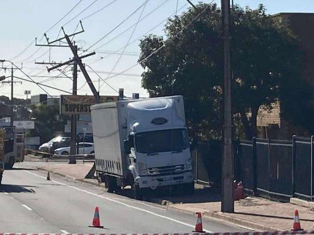 Emergency services at the scene of a crash, where a truck has slammed into a stobie pole on South Rd at St. Mary's.  Picture: 7 News Adelaide.