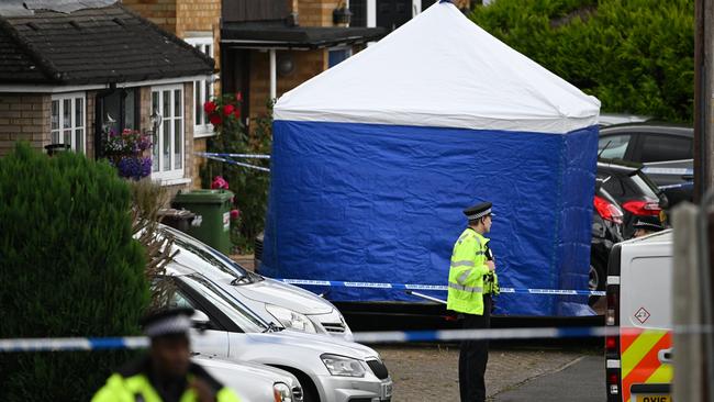 Police officers at the home in Bushey, UK, where three women were found dead. (Photo by Leon Neal/Getty Images)