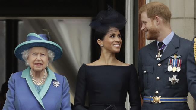 Queen Elizabeth II, Meghan, Duchess of Sussex, and Prince Harry at Buckingham Palace in London. Picture: AP