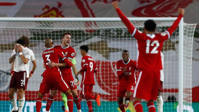 Liverpool striker Diogo Jota, third from left) celebrates his team's third goal against Arsenal at Anfield